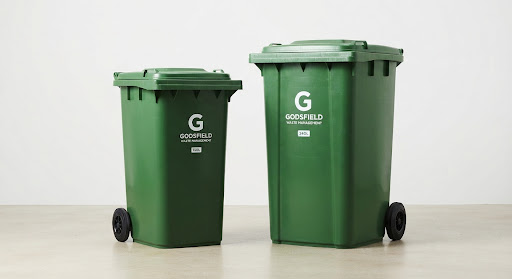 Two durable green household waste bins